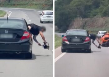 Videomaker se pendura para fora de carro para fazer imagens de Lamborghini na BR-153; vídeo